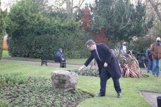 Leader of Charnwood Borough Council, Cllr Jonathan Morgan laying a pebble