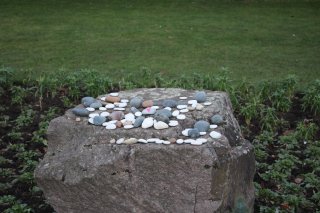 Pebbles that were laid by residents attending the service