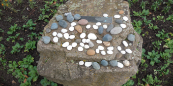 Pebbles laid on the Holocaust Memorial Day commemoration stone