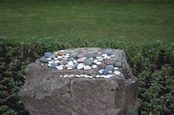 Pebbles that were laid by residents who attended.