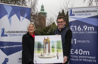Sylvia Wright, the Council's head of leisure and culture, and Cllr Jonathan Morgan, co-chair of Loughborough Town Deal hold an image of the Hope Bell which forms part of the Lanes and Links project which is being supported by the Town Deal