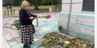 Mayor of Charnwood, Cllr Jennifer Tillotson, collecting flowers at the Carillon Tower at Queen's Park in Loughborough