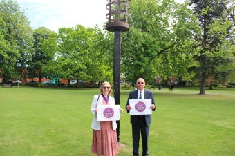 Picture shows Cllr Jenni Tillotson and Loughborough resident Stephen Hutchins in front of the beacon at Queen's Park, Loughborough