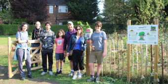 Photo shows representatives from Earthwatch Europe, Council officer ansd local residents at the Tiny Forest.