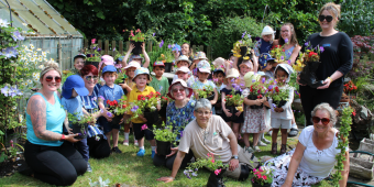 Picture of Watermead Day Nursery children and members from Loughborough in Bloom and idverde with their plants